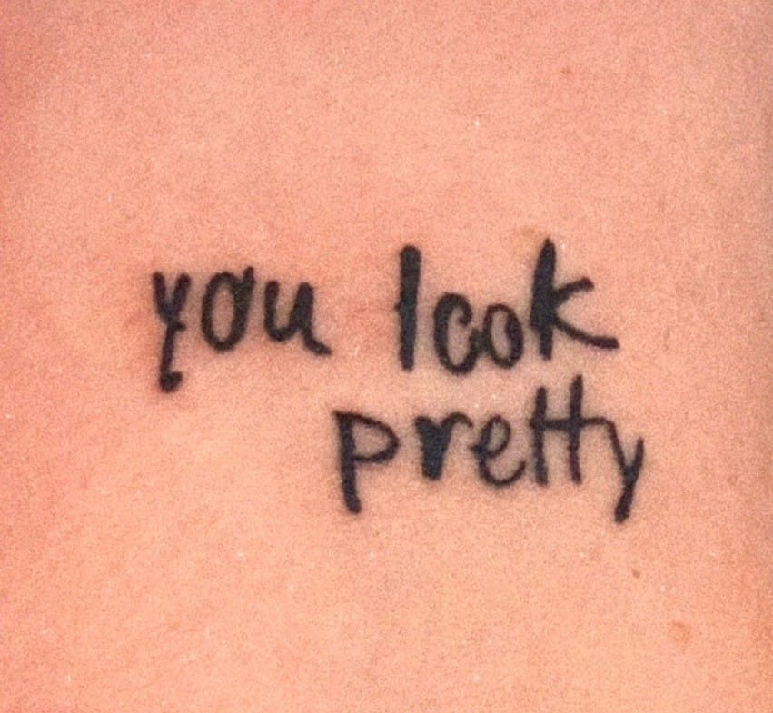 Someone in the Heated Rivalry fandom asked Connor Storrie to write "you look pretty" in his own handwriting (IYKYK), and then she got it as a tattoo. Since I kinda picture that commercial shoot as their first date, I extra love this. This tatt needs to be spread around the world!