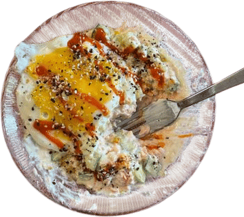 Salmon with Greek yogurt, cucumber, an egg, hot sauce, and seasoning