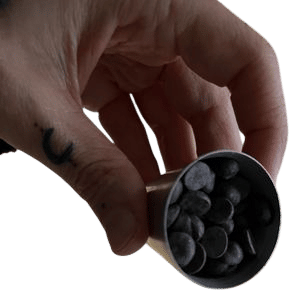 a shot glass of dark chocolate chips