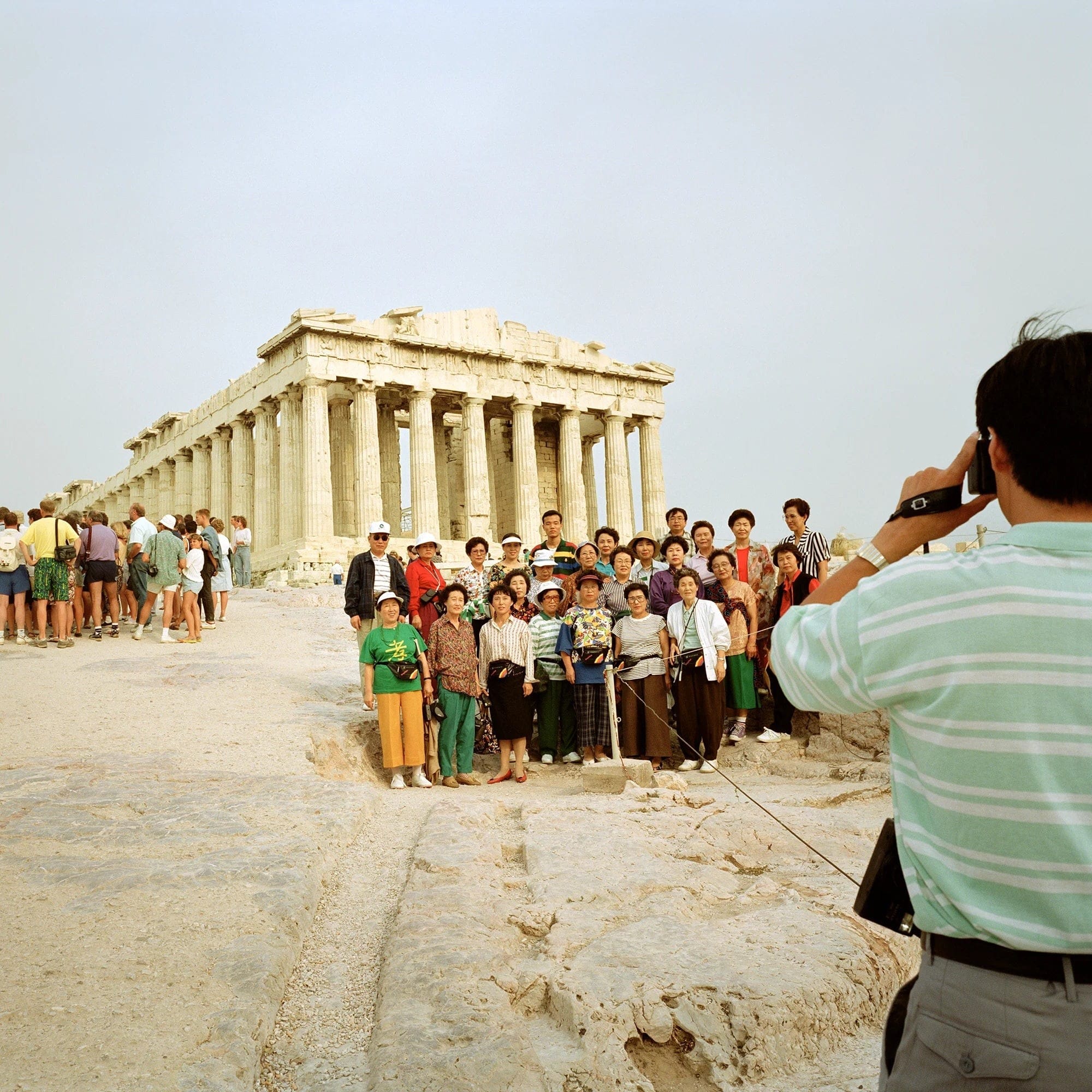 Be the anonymous photographer of a group