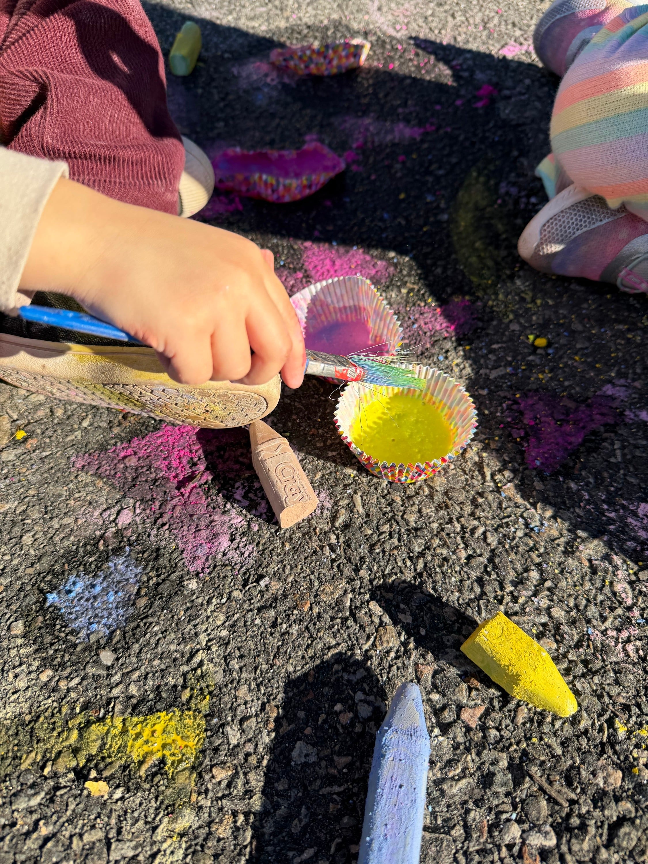 Crushing bits of chalk into pigment so you can create chalk paint