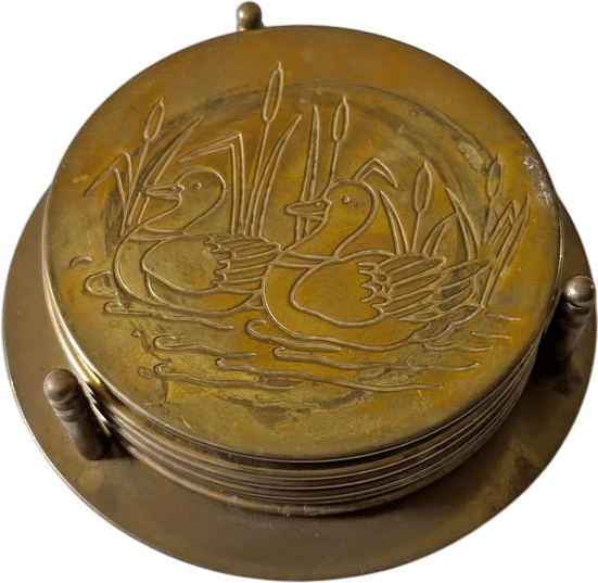Vintage brass duck coaster set