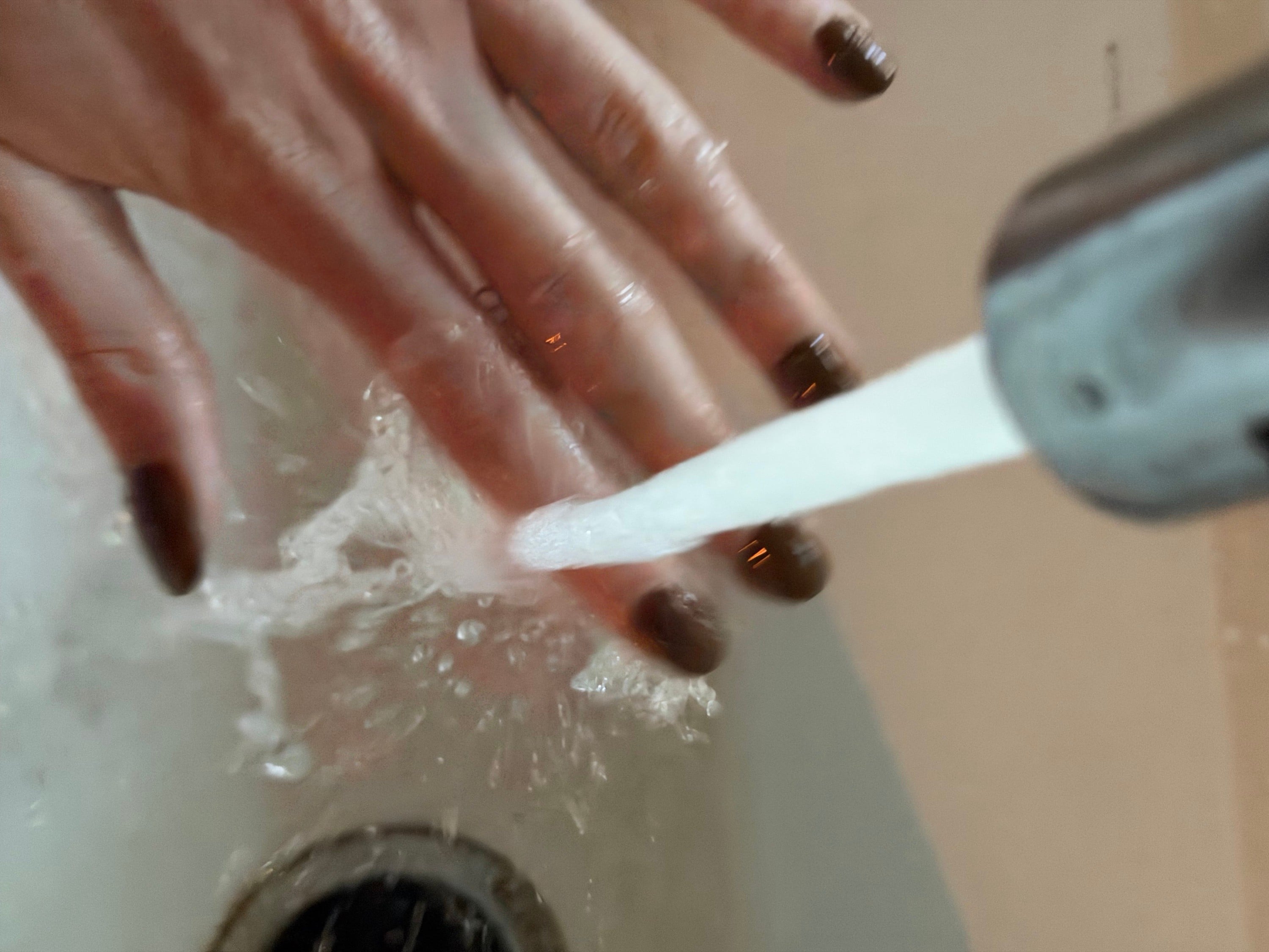 running your nails under cold water after you paint them