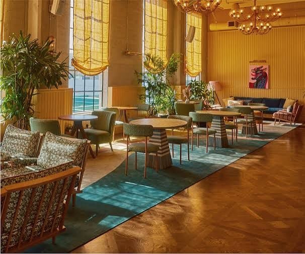 A gym that is also a co-working space and a pool and a nail salon and a resturant