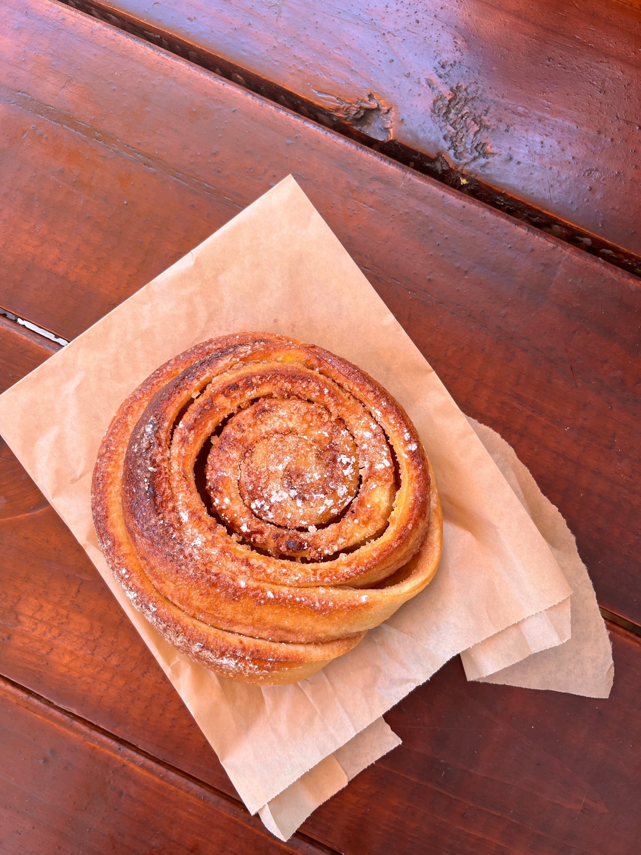 eating a cinnamon roll in your car