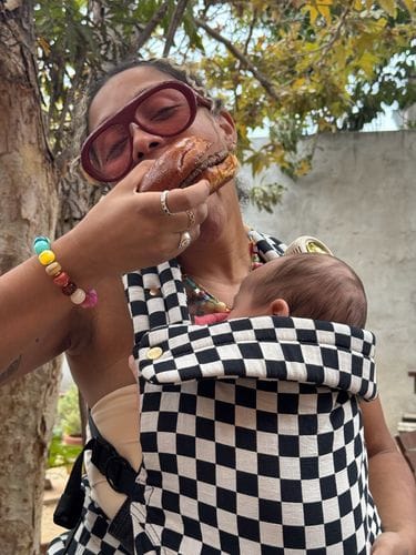 eating a burger over your baby’s head