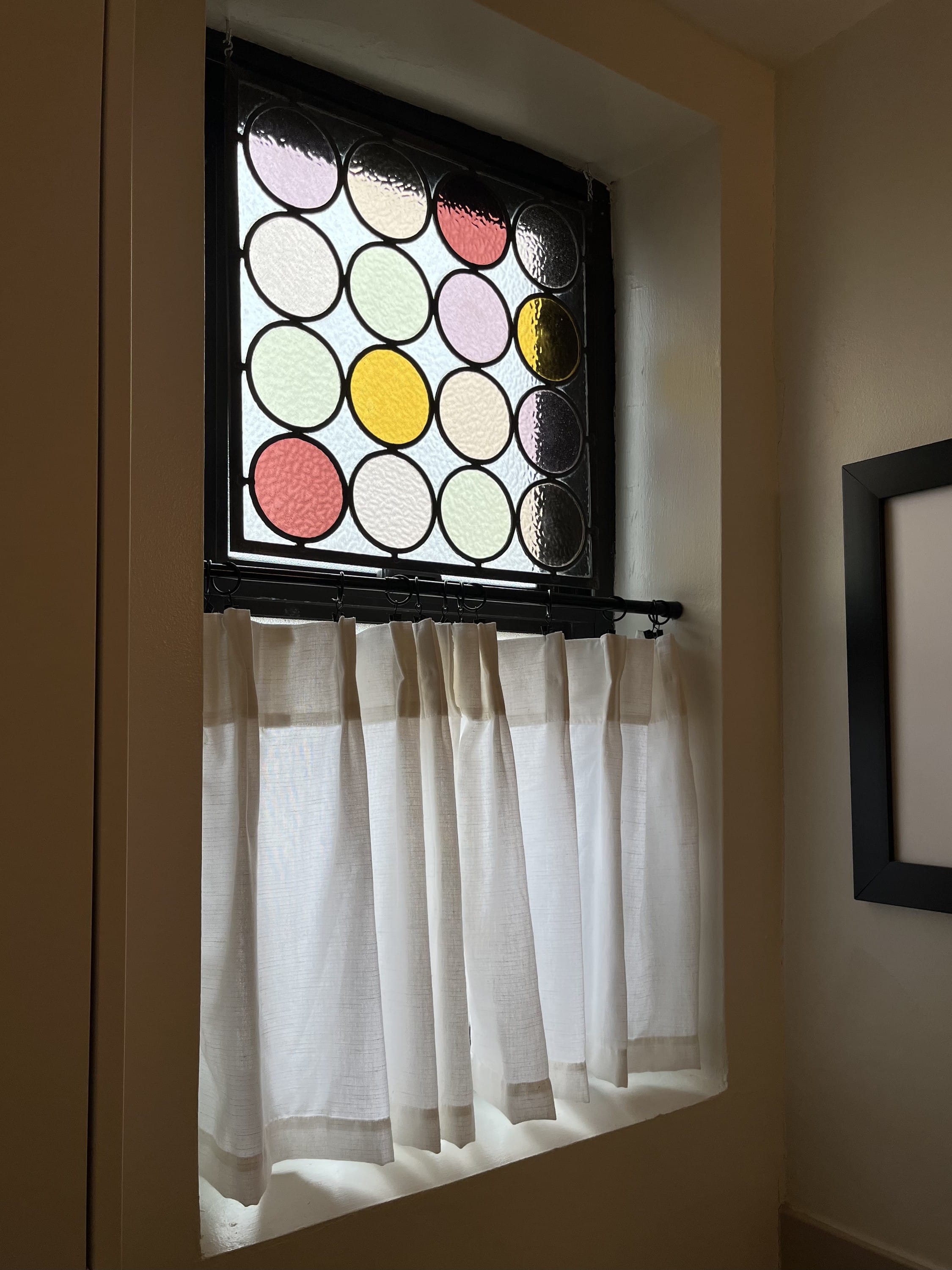 Hanging stained glass in front of a window