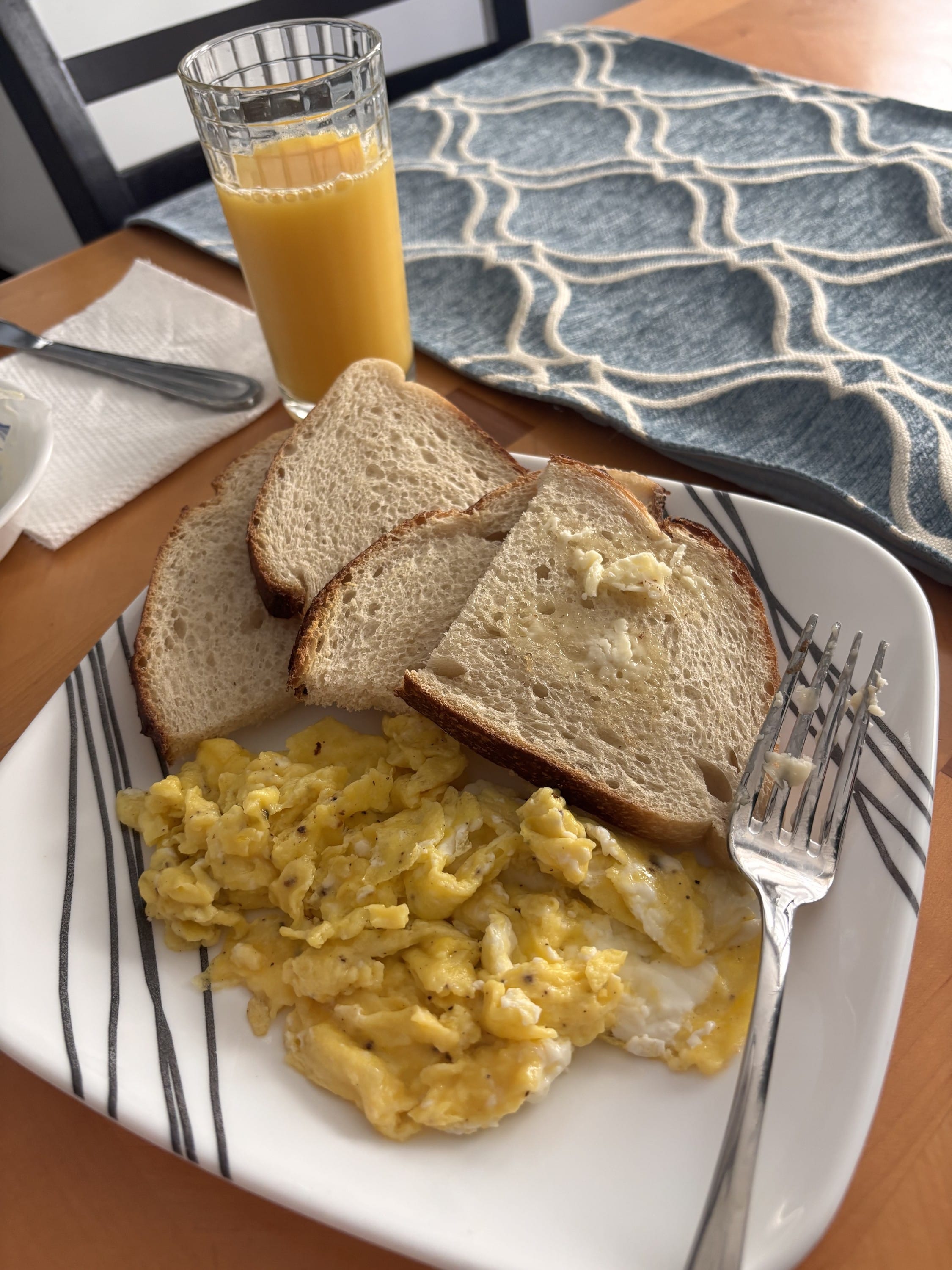 Eating eggs and toast prepared by someone who loves you