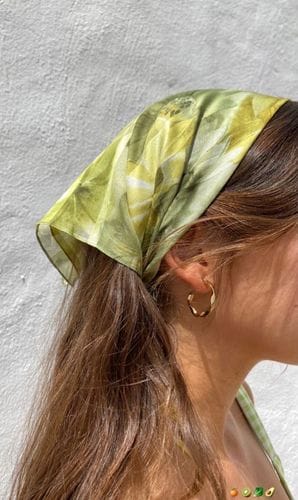 Put a headband under your hair scarf to hold it in place