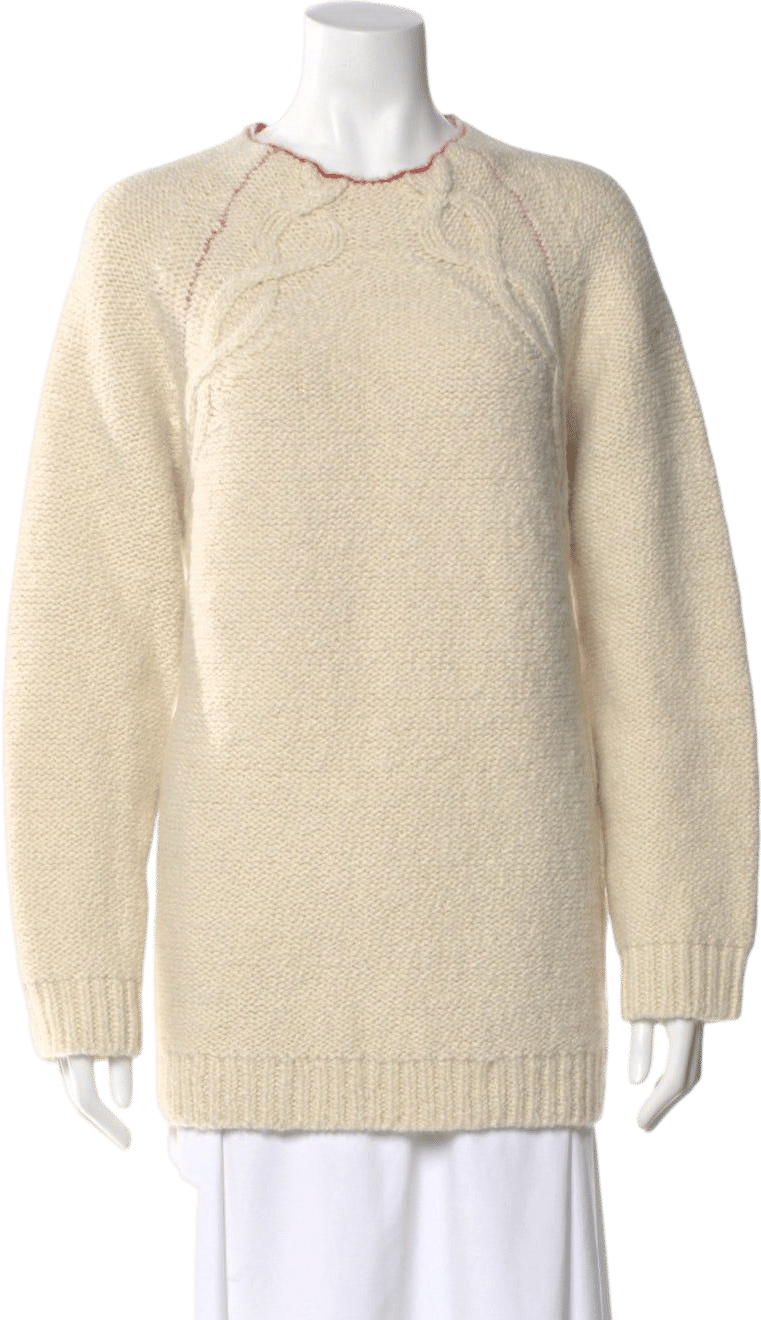 Cozy oversized alpaca sweater with red trim at neckline. 