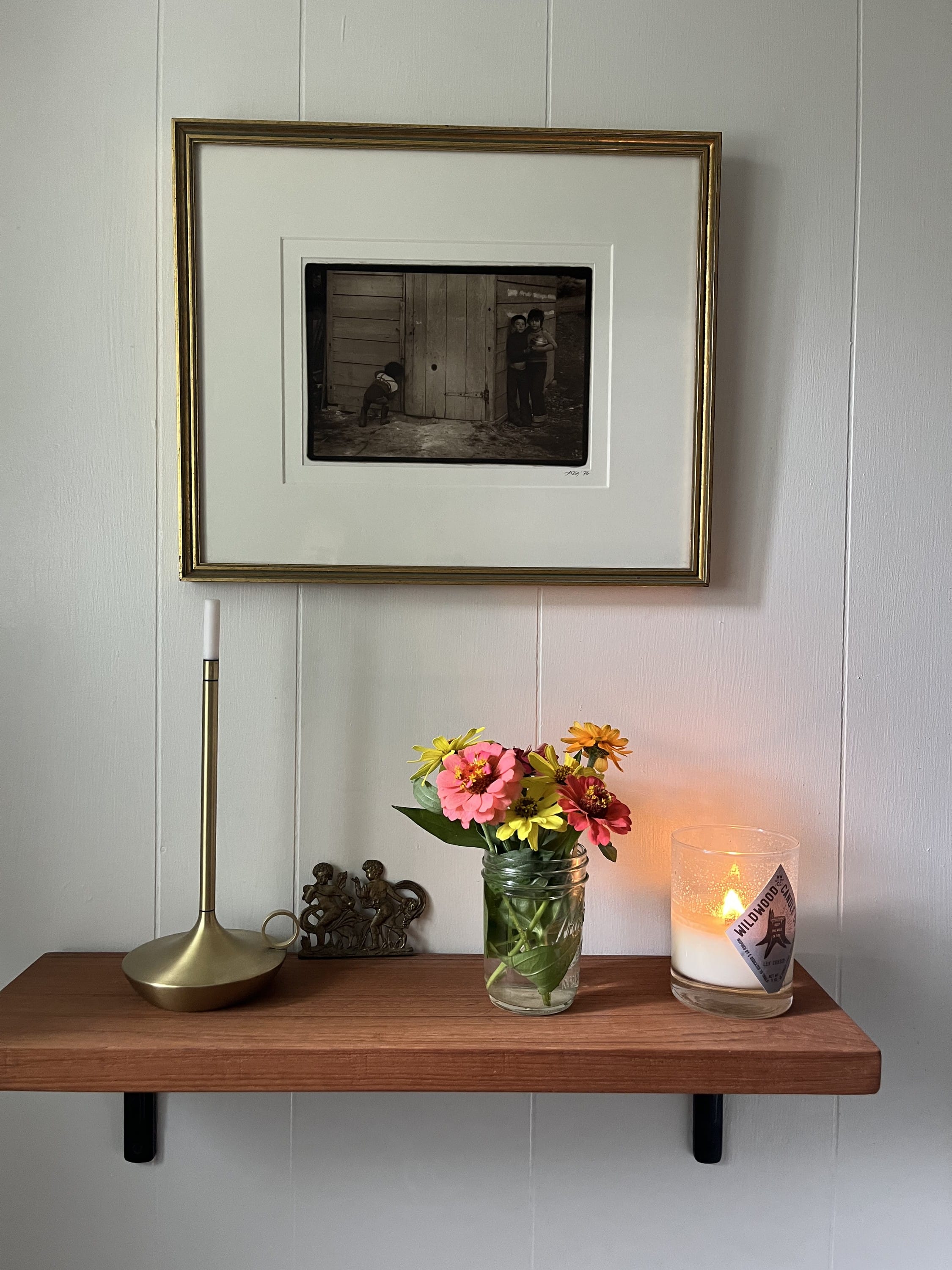fresh flowers. lit candle.