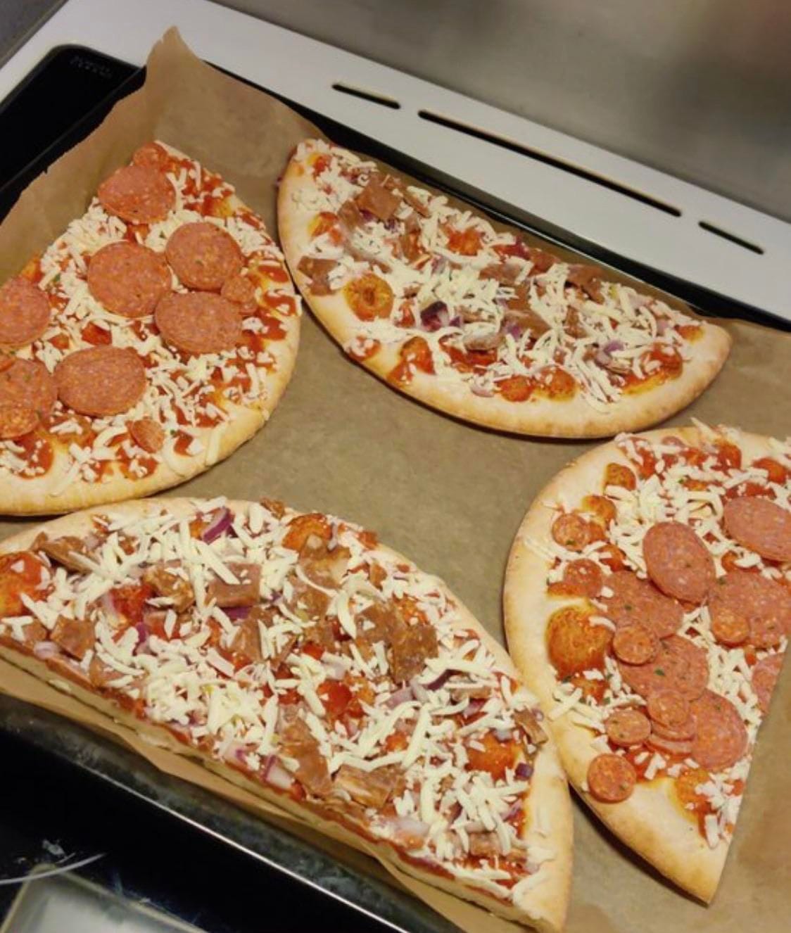 Cooking two pizzas at once by cutting them like this