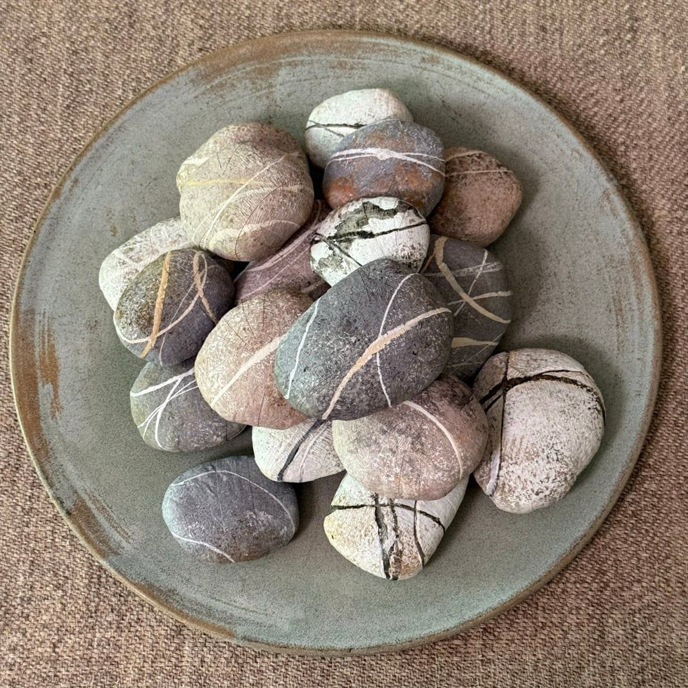 Anandamayi Arnold (Lynx and Telescope) river stone prize balls