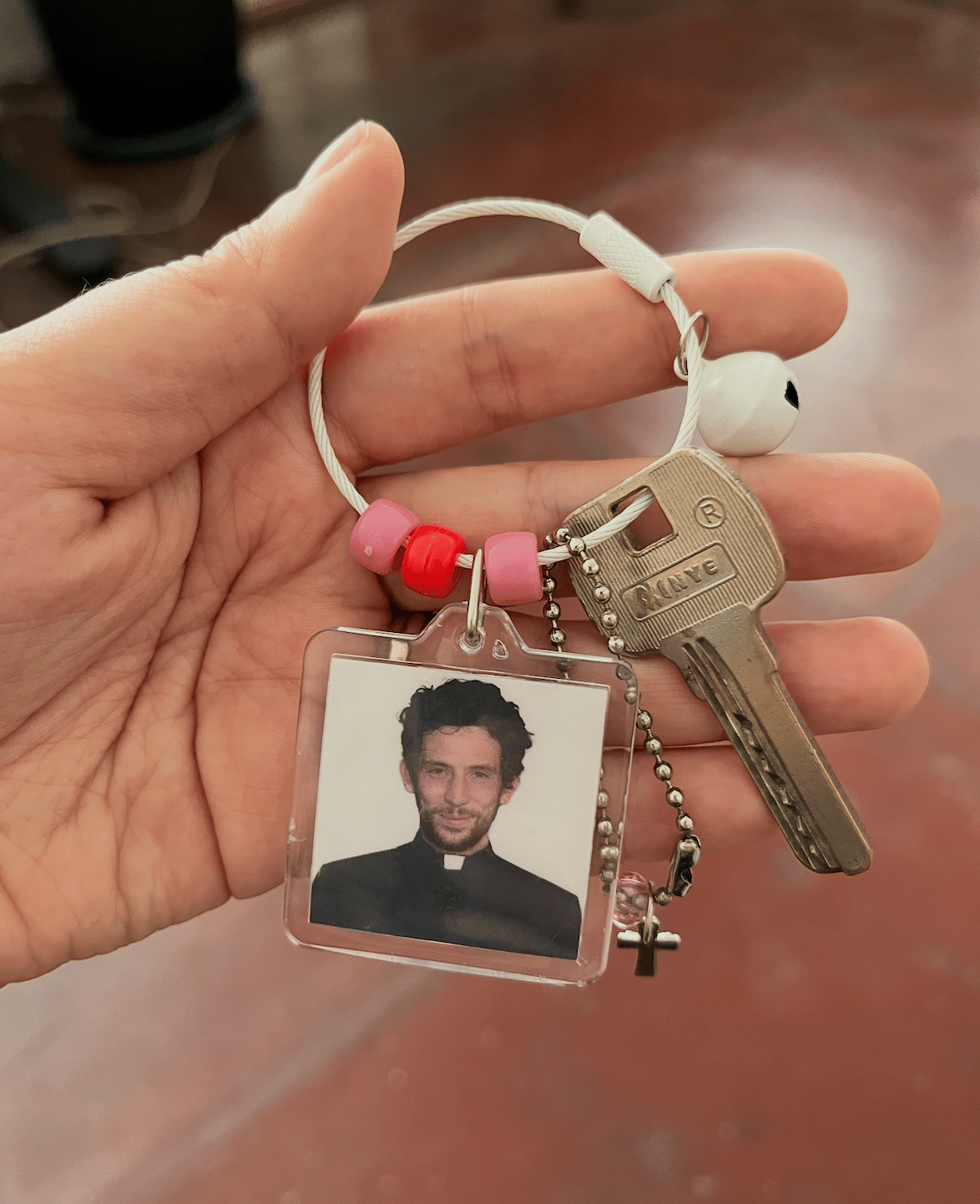 A keychain with your favorite cinematic priest