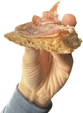 Eating A Slice of Rustic Bread with a Piece of Good Salami