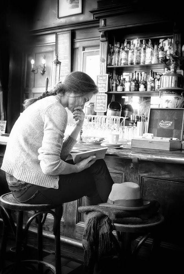 reading my book at a bar