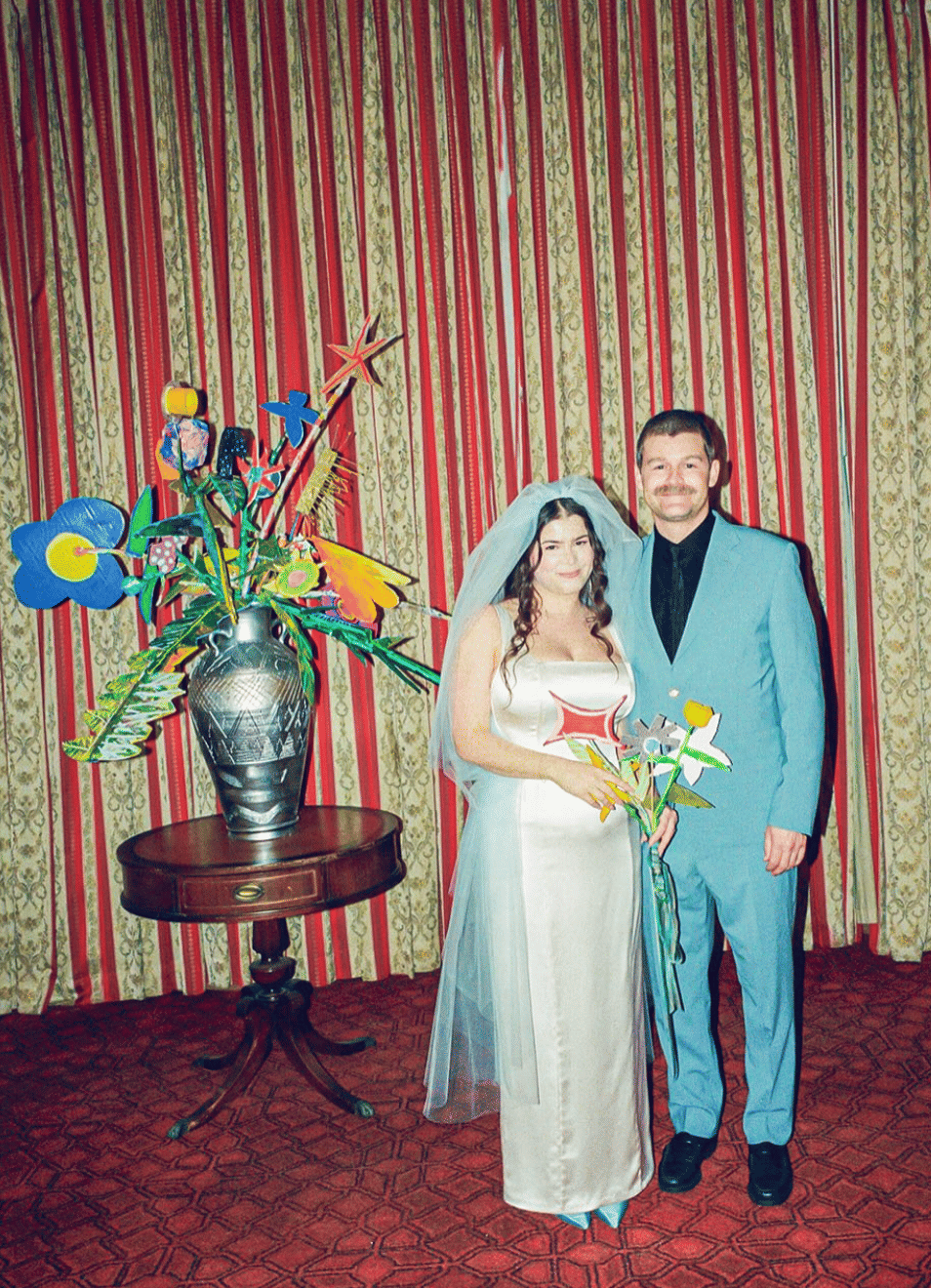My artist husband made every single flower in the venue out of cardboard, paint and LOVE