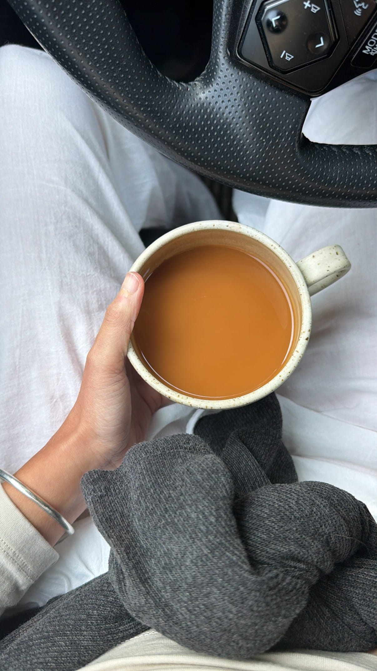 Drinking coffee in your car out of your ceramic mugs...