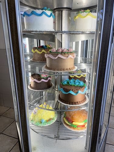 a mere glimpse into a cake pastry case