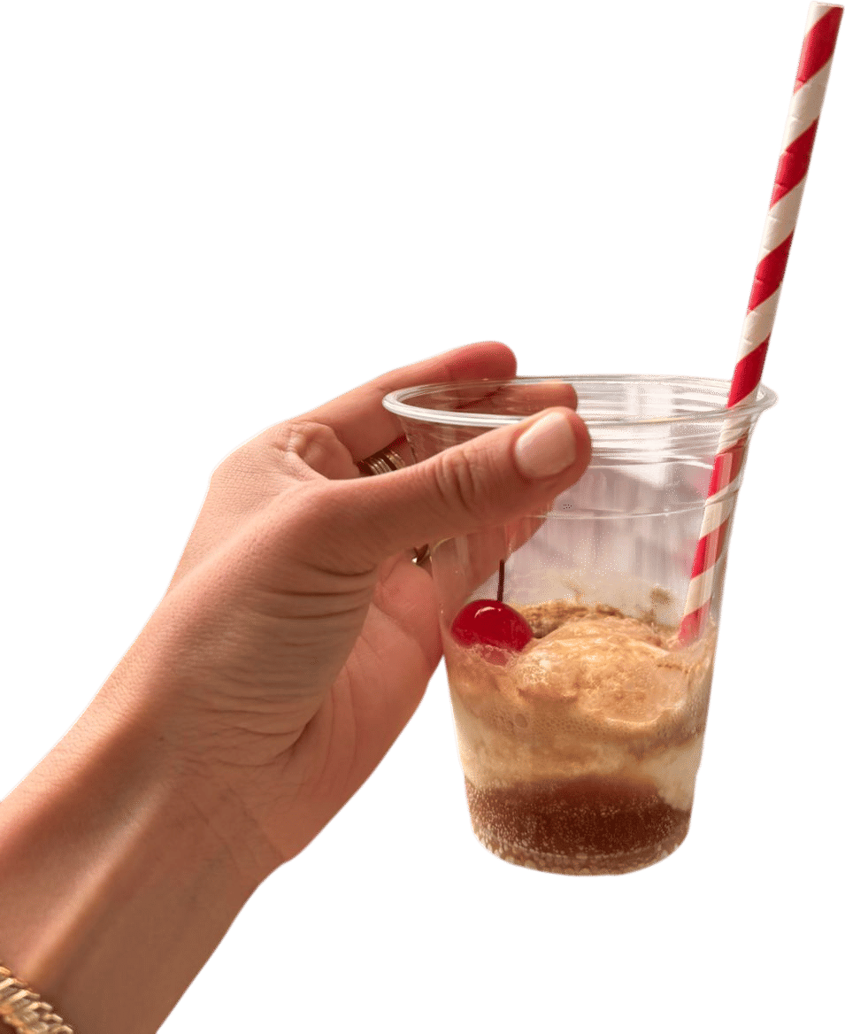 root beer, a stack of cups and a cooler with vanilla ice cream in it, some cute striped paper straws, jar of marischino cherries