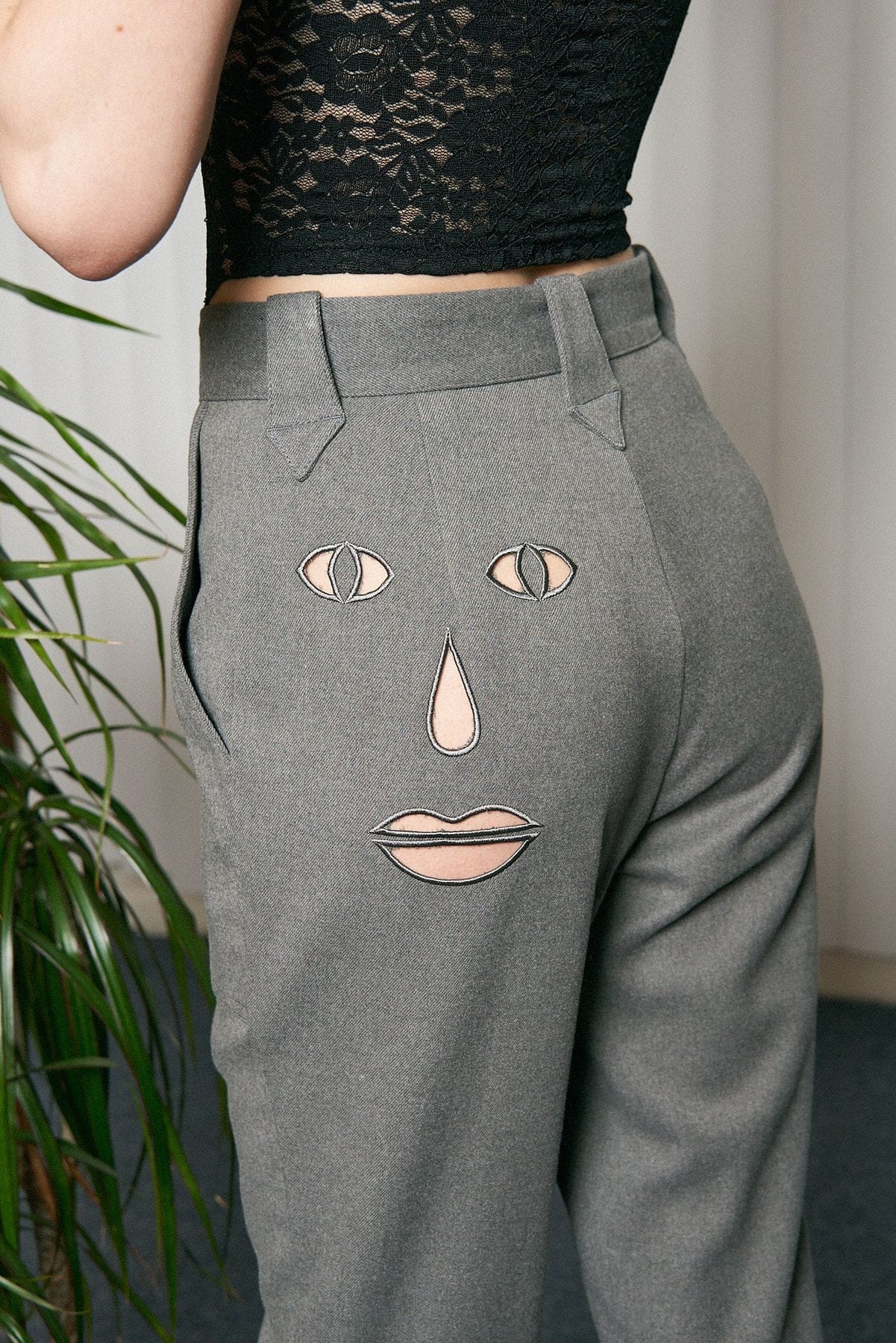Face cut out trousers