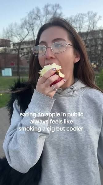 Eating an apple while walking down the street