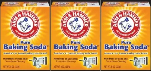 An open box of baking soda in the fridge