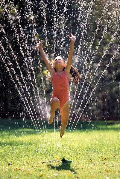 #325 Jumping through the sprinkler in your bathing suit - 1000 Awesome Things
