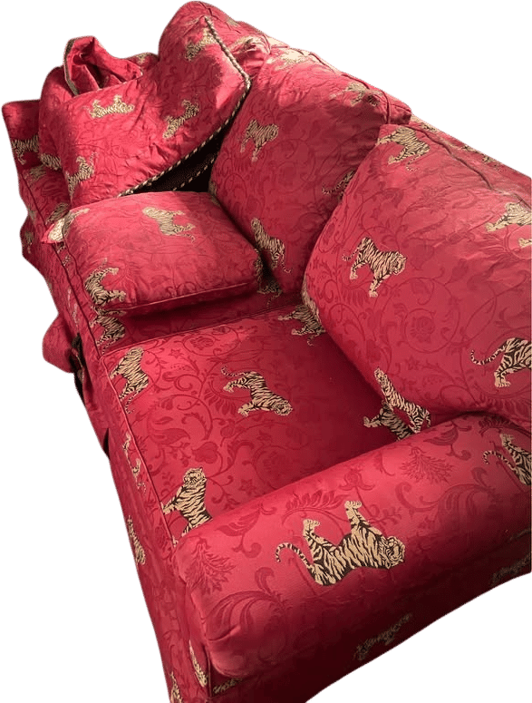 Tigers on red couch with pullout bed