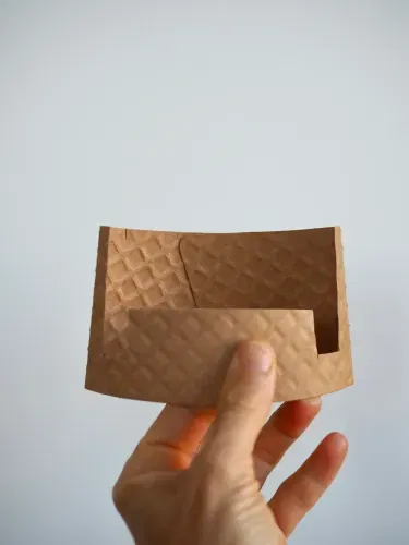 Coffee cup sleeve phone stand