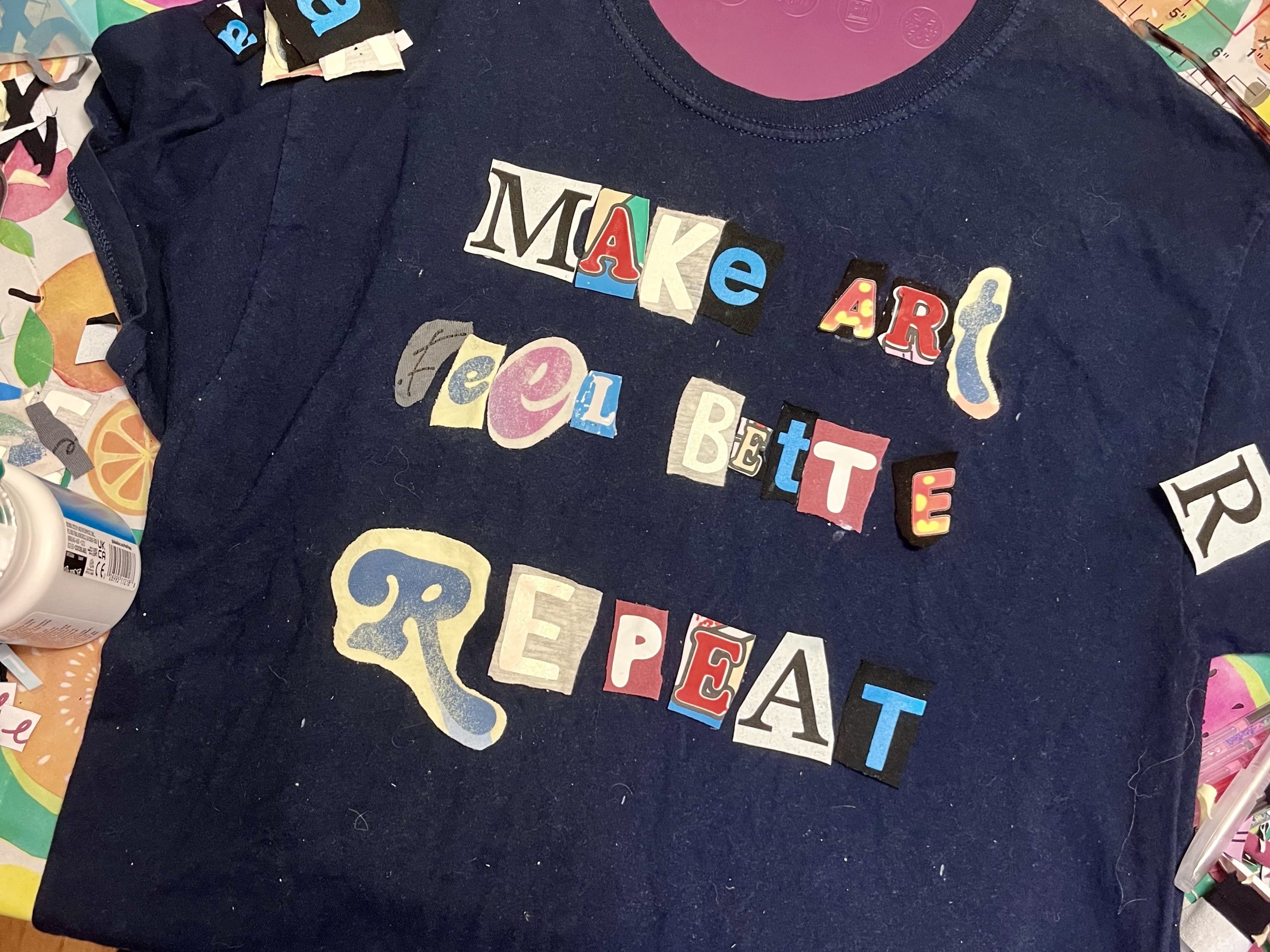 Cut out the letters from old clothing to make word art t-shirts