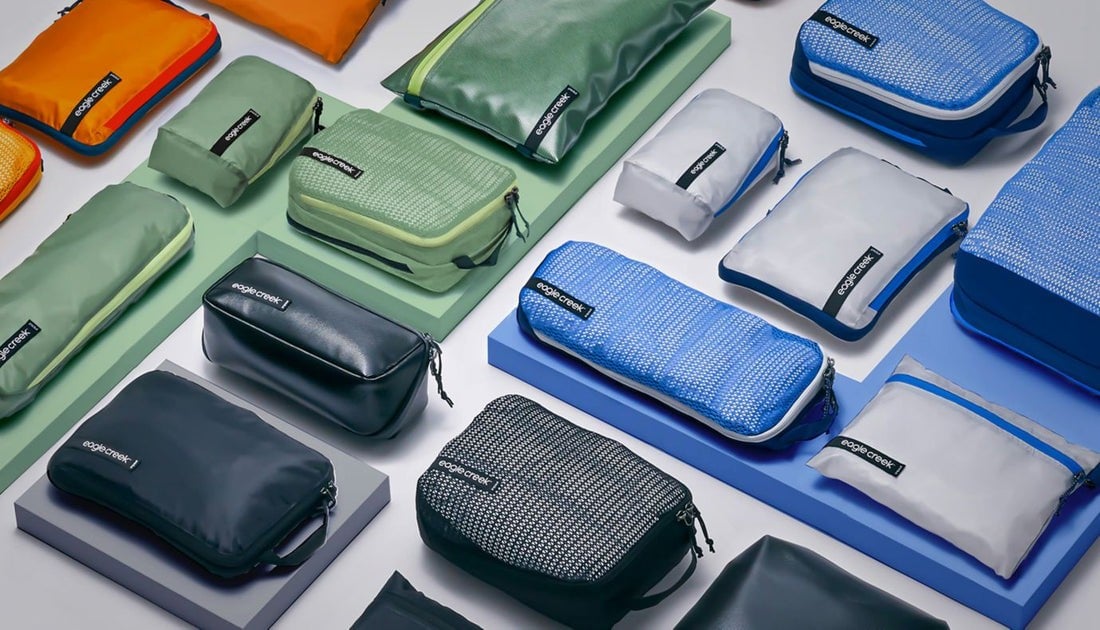 Different colored packing cubes for each family member