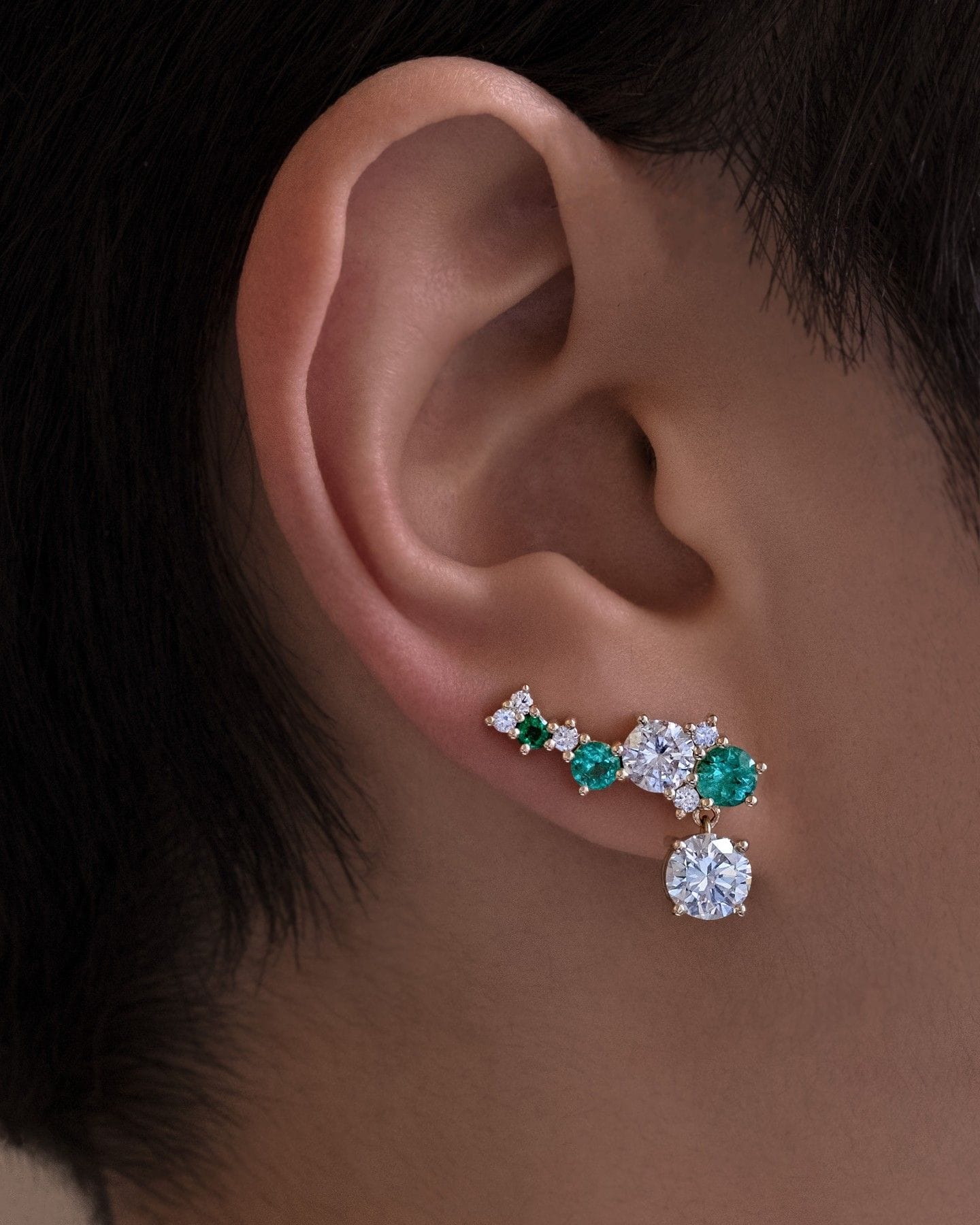 Diamond and emerald ear climbers by Spur Jewelry