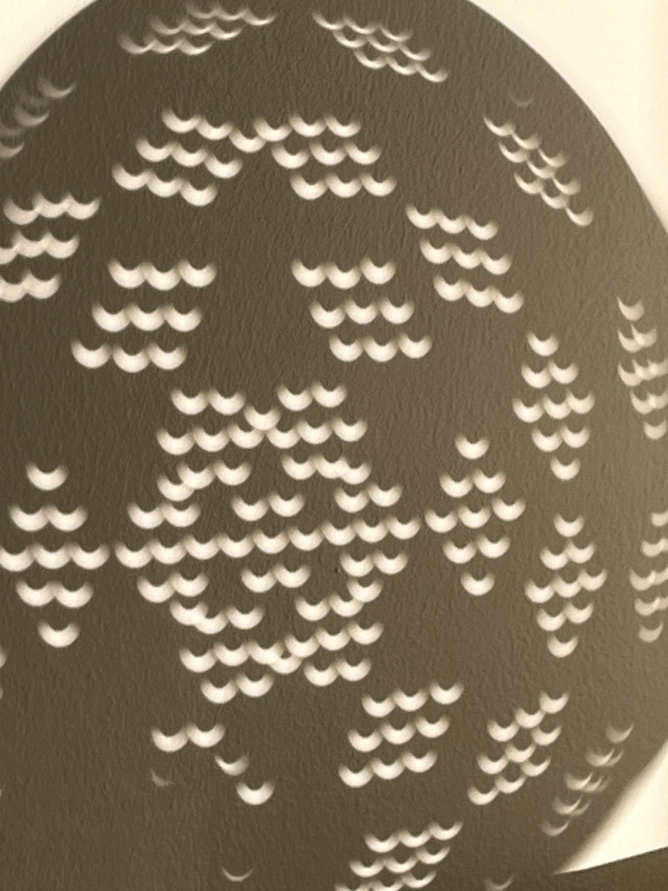 Eclipse through a colander
