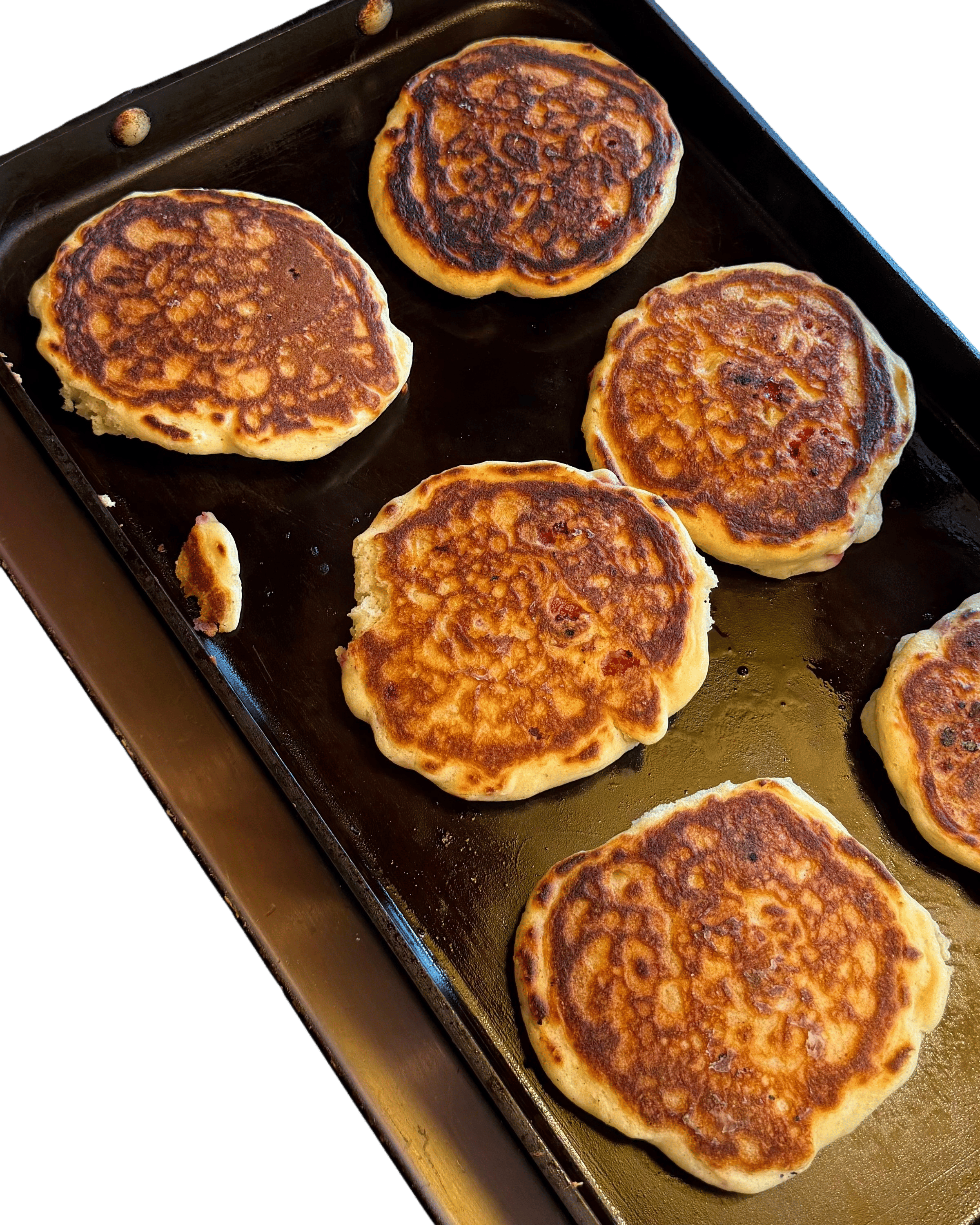 Adding fresh raspberries to pancake batter