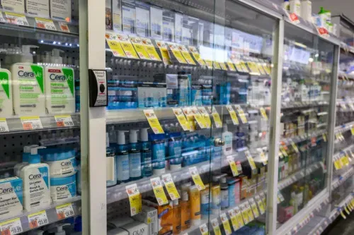 Chatting with other shoppers also waiting for a CVS employee to unlock the plastic cabinet
