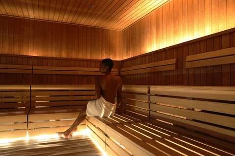 If you can, book a massage, sauna, or acupuncture while you're traveling.