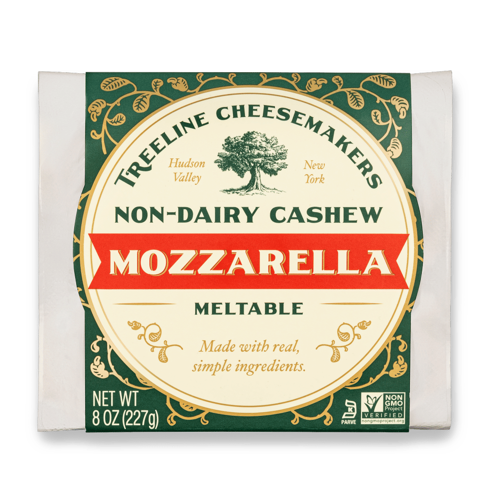 boil up some mini-pasta shells, once cooked toss in a pan with some marinated artichokes, chopped tomato, red onion, a little marinara if you've got it (if not throw in some tomato paste with a lil veggie stock), and this is key Treeline cashew mozzarella that you've shredded.
