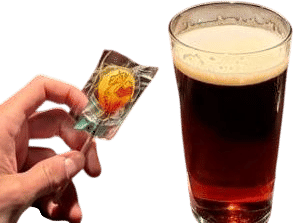 a dark beer and a lollipop