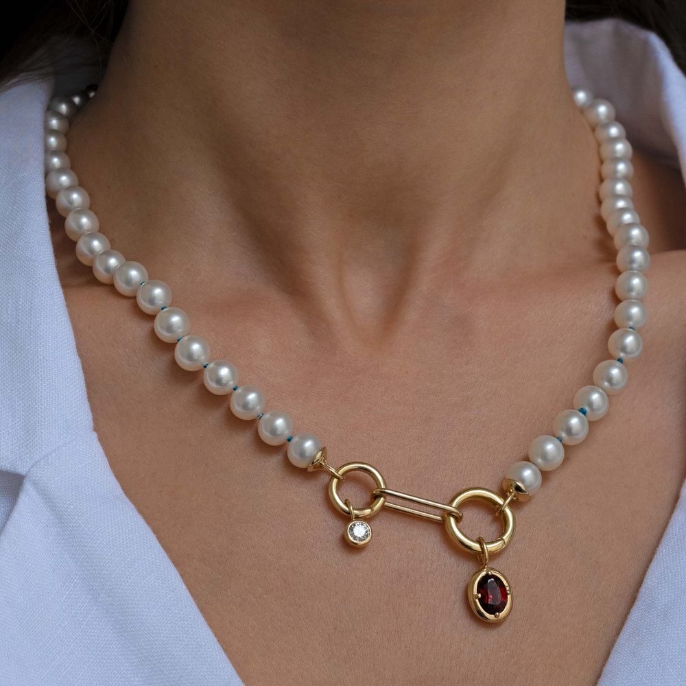 Transform old pearls into a super useful charm holder and add all your cute charms