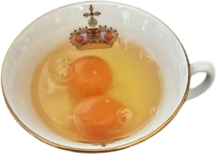 using a tea cup to pour eggs into the pot for poaching