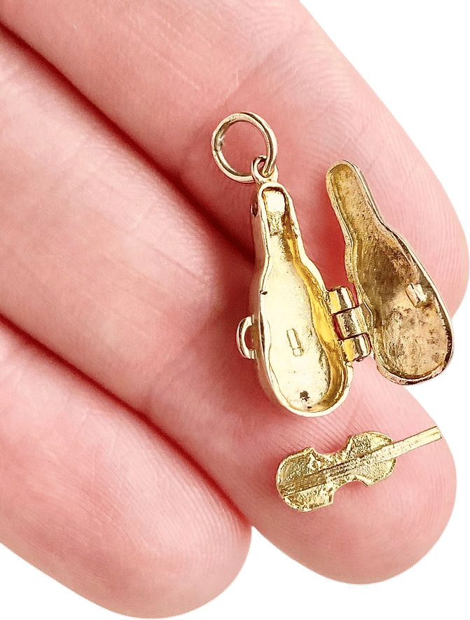 This vintage gold charm that LITERALLY OPENS TO REVEAL THE WORLD'S TINIEST VIOLIN